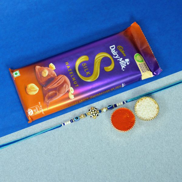 Blue Meenakari Rakhi with Dairy Milk Silk Hazelnut